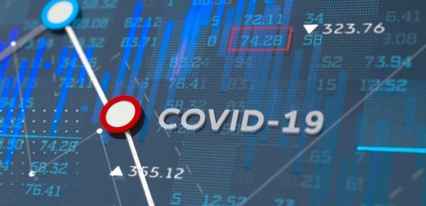 COVID-19 Schriftzug auf Grafik mit Daten