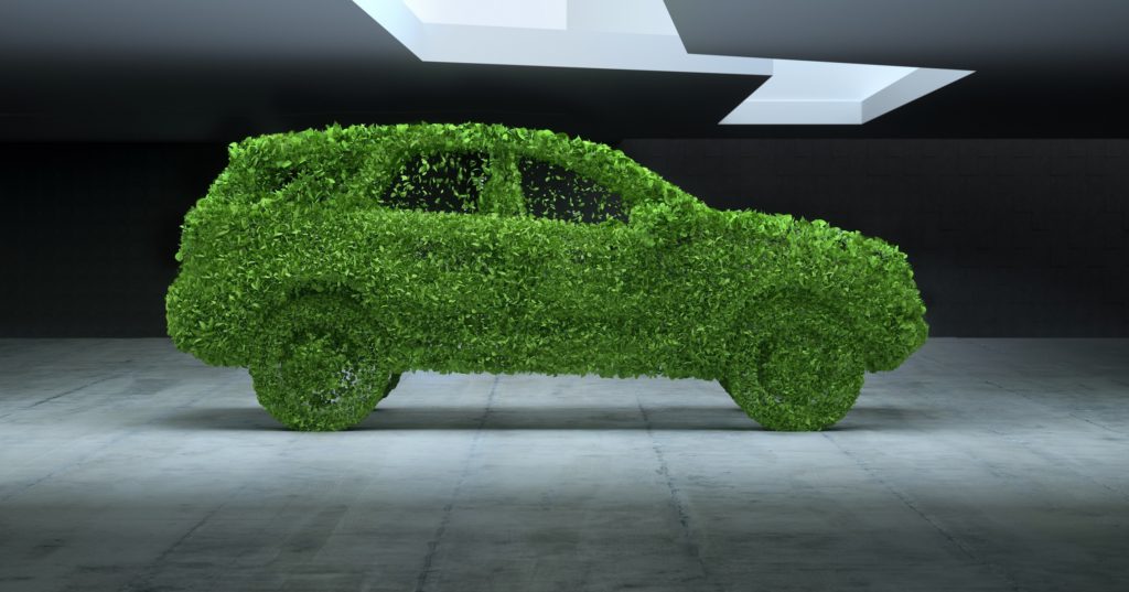 Digital generiertes Bild eines generischen SUV-Autos, das aus grünen Blättern in einem städtischen Betonraum besteht.